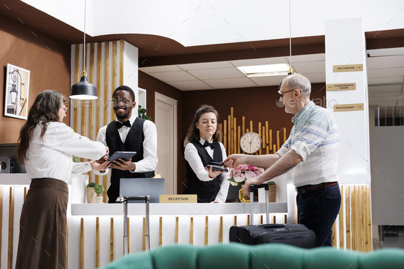 Helping senior guests check-in & pay