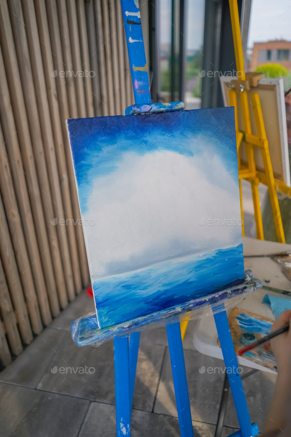 A close-up of easel for painting that stands in the studio concept of the  love of fine art Stock Photo by guyswhoshoot