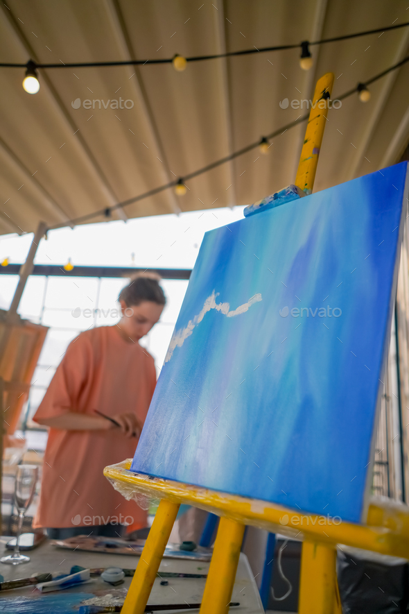 A close-up of easel for painting that stands in the studio concept of the  love of fine art Stock Photo by guyswhoshoot