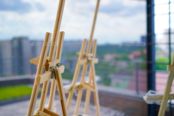 A close-up of easel for painting that stands in the studio concept of the  love of fine art Stock Photo by guyswhoshoot