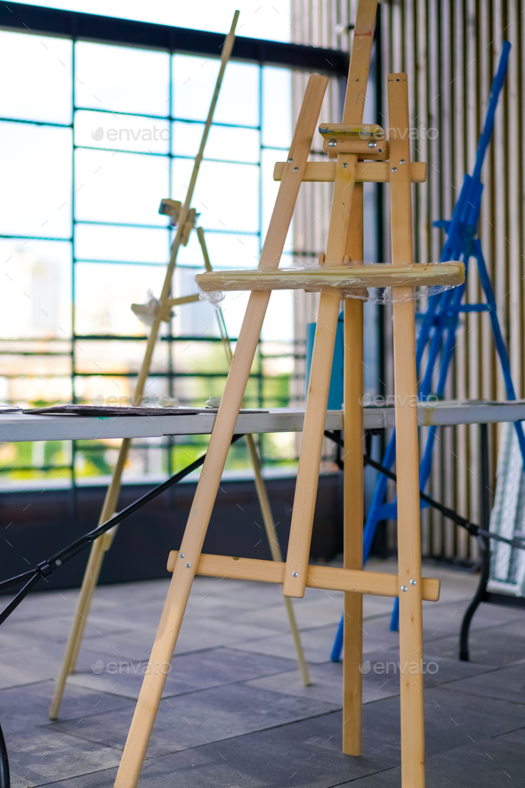 A close-up of easel for painting that stands in the studio concept of the  love of fine art Stock Photo by guyswhoshoot
