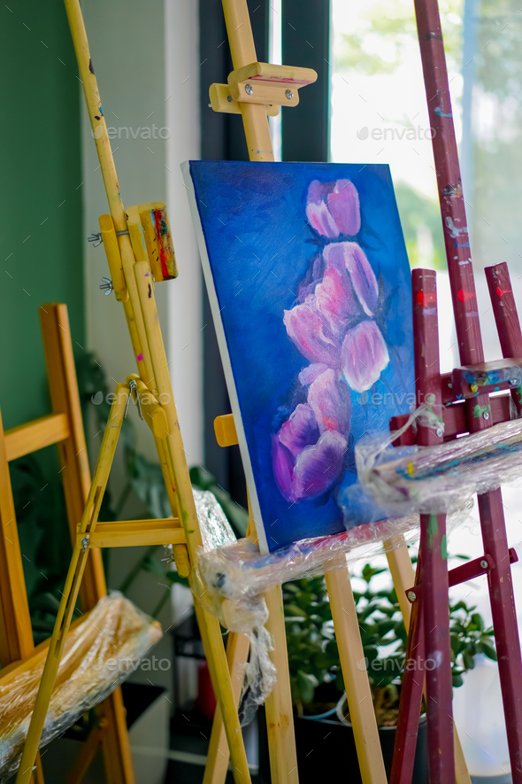 A close-up of easel for painting that stands in the studio concept of the  love of fine art Stock Photo by guyswhoshoot