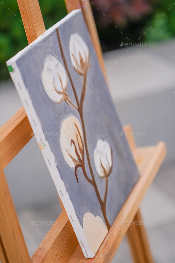 A close-up of painting standing on an easel in a studio for painting the  concept of love of fine art Stock Photo by guyswhoshoot