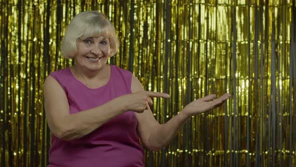 Senior Old Woman Pointing Empty Place on Her Palm, Copy Space Advertising Area on Hand alt