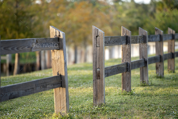 Wooden fence barrier at farm grounds for cattle and territory ...