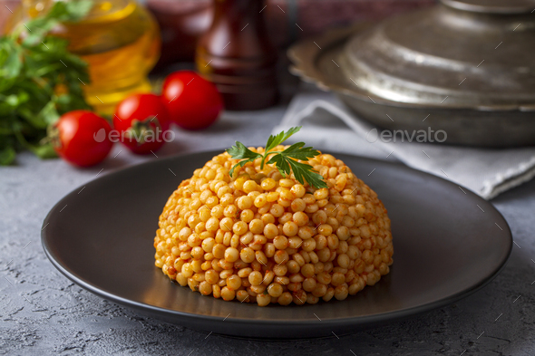Couscous pilaf with tomatoes. Turkish name; domatesli kuskus pilavi - Stock Photo - Images