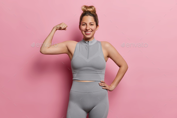Young Female Flexing Bicep. Stock Image - Image of girl, lady