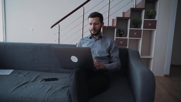 Man Using Pc Computer and Sitting at Home