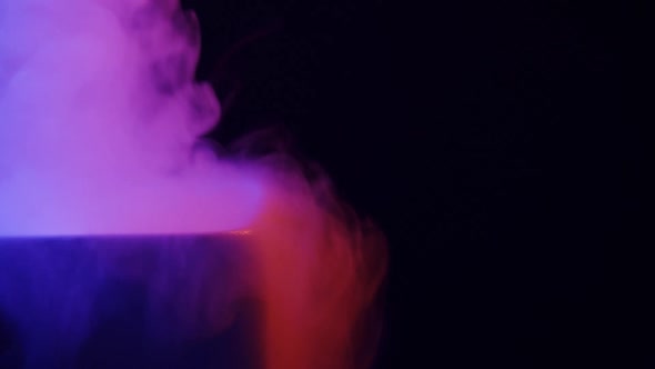 Steam in Colored Lighting on a Black Background