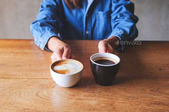 Close up photo of sexy women holding cups with coffee Stock Photo