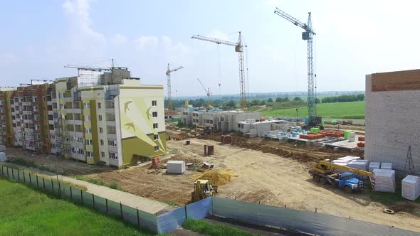 construction of boxes of modern high-rises at the initial stage in the city. Aerial view alt