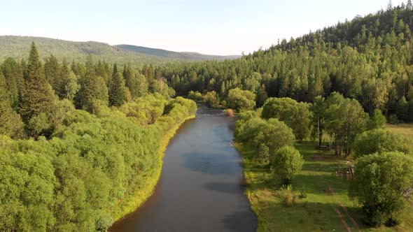 Aerial Flying of Drone Over Mountain River, Field, Forest and Path.