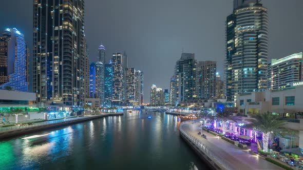 Time lapse of Dubai Marina and lake or river, Downtown skyline, United Arab Emirates or UAE. alt