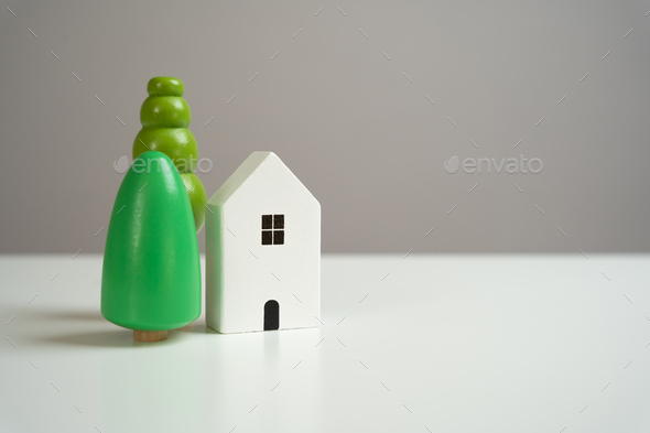 Figures of a house with trees. Housing Buying or renting a house.