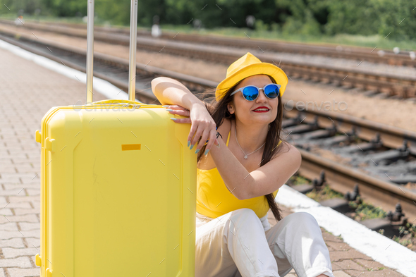 Holiday mood: a female image in yellow is preparing for adventure ...