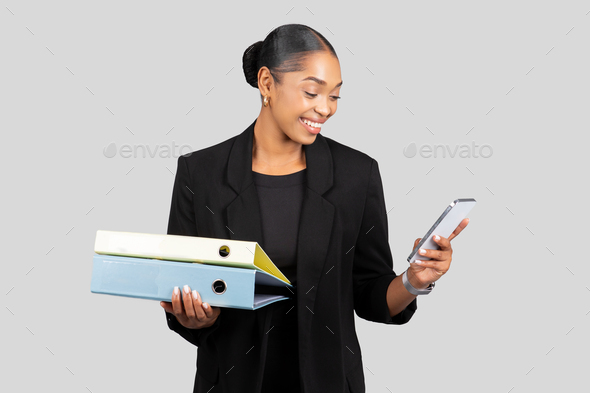 Young plus size businesswoman smiling happy holding binder in the