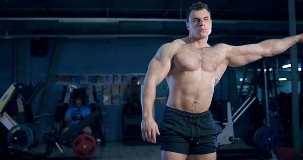 Bodybuilder Comes to the Simulator and Does the Exercise in the Gym alt