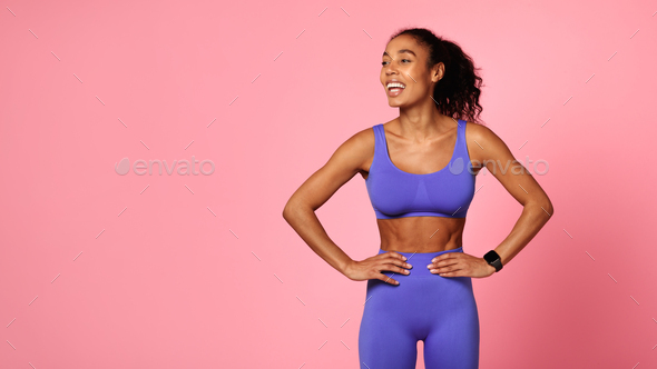 Black Fitness Woman Wearing Purple Sportswear Posing Over Pink Background  Stock Photo by Prostock-studio