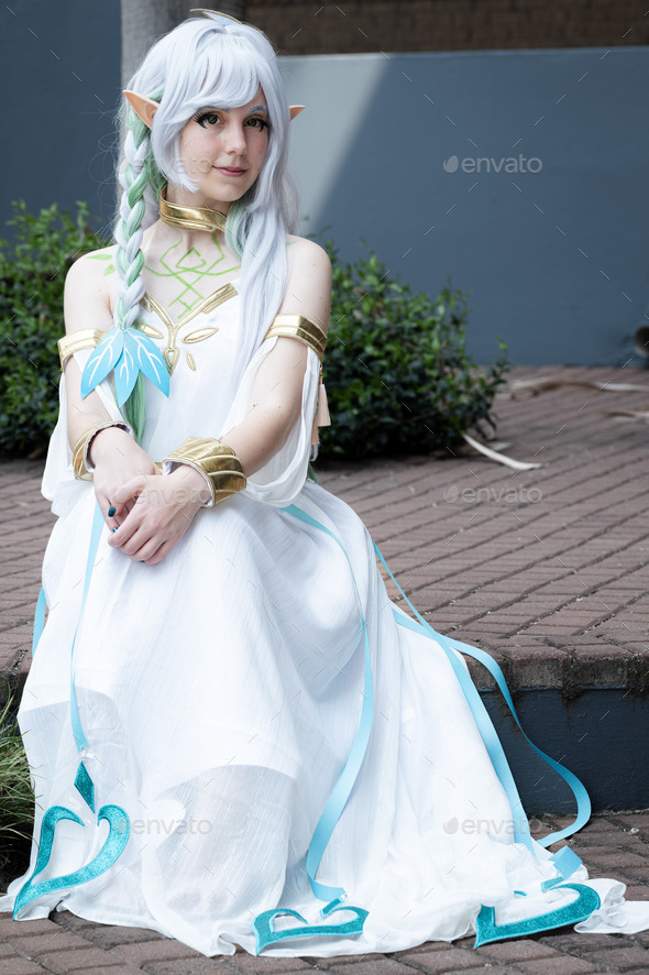 Caucasian female cosplayer dressed as an anime character in a