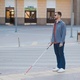 young blind man with white cane walking across the street in city Stock  Photo by sedrik2007