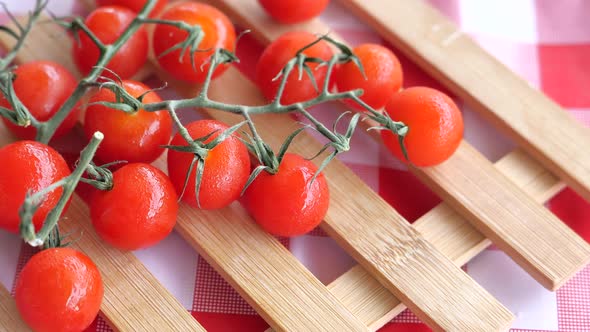 Closeup of Fresh Cherry Tomato on Table Cloth alt