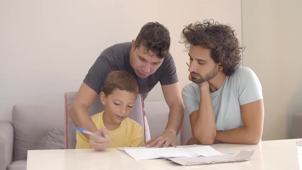 Dads Helping Son with School Home Task alt