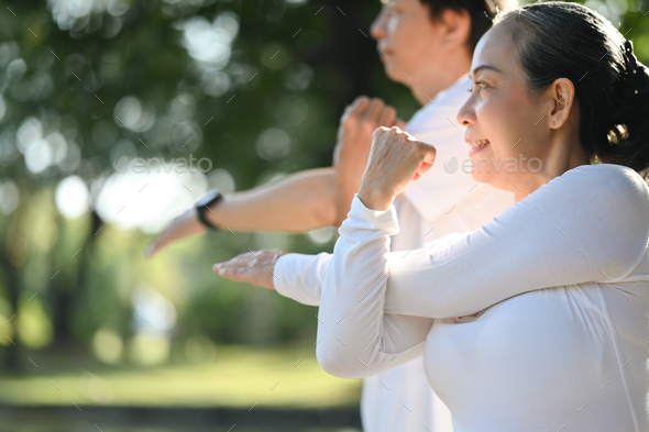 Portrait, stretching and active seniors at a park for training