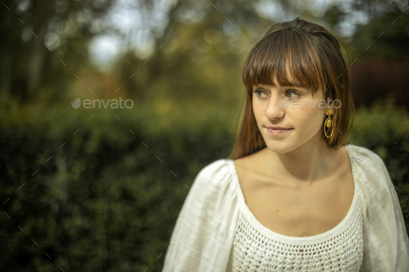 Portrait of a Young Brunette Outdoors in Summer · Free Stock Photo