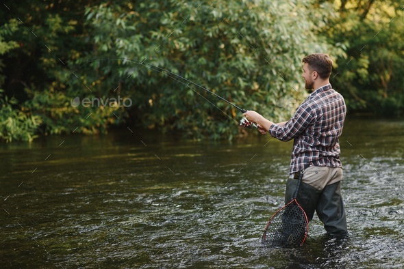 Male hobby. Ready for fishing. Relax in natural environment. Trout bait  Stock Photo by sedrik2007