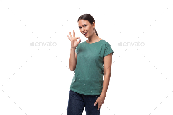 young confident slim woman dressed in a green basic t-shirt with print mockup. corporate clothing