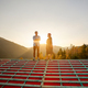 Man and woman enjoy beautiful sunset in the mountains - PhotoDune Item for Sale
