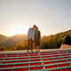 Man and woman enjoy beautiful sunset in the mountains - PhotoDune Item for Sale