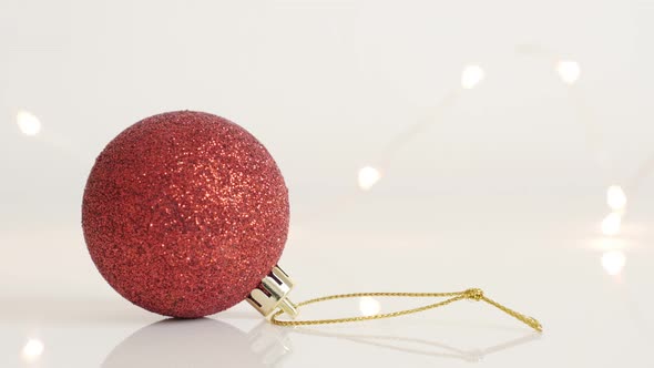 Close-up of bauble with sequins  4K 2160p 30fps UltraHD tilting  footage - Red Christmas ornament an alt