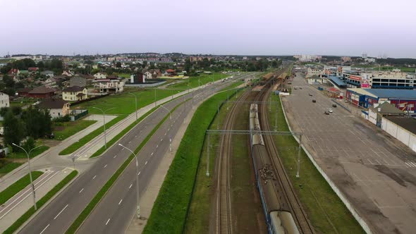 City electric train travels in the city. View from the drone