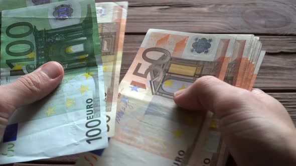 Man Counting Euro Banknotes 5 alt