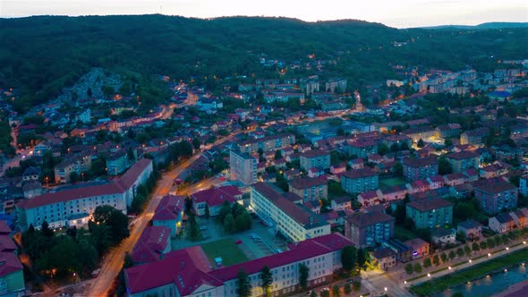 Aerial hyper-lapse view of a neighborhood in Resita city, Romania, after sunset