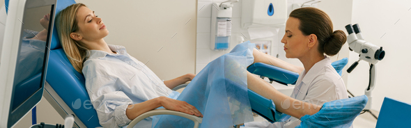 Young woman on appointment with her gynecologist during regular visit to women\'s consultation