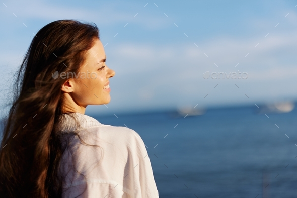 Woman beauty smile with teeth freedom on vacation walking on the beach ...