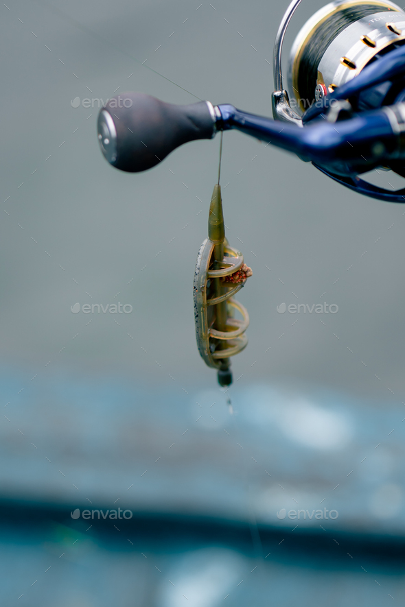 close-up Fishing tackle fishing spinning hooks and baits fisherman on  reservoir feeder free style Stock Photo by guyswhoshoot
