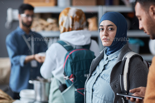 Middle Eastern Woman Looking at Camera at Refugee Help Center