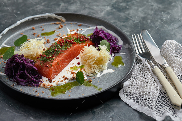 Gourmet dish. Smoked salmon with vegetables. Salmon dish for restaurant