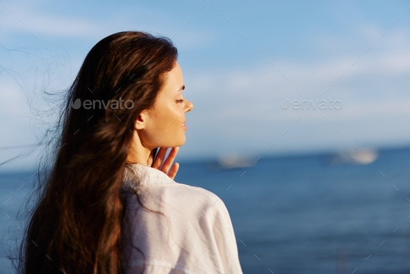 Woman beauty smile with teeth freedom on vacation walking on the beach ...