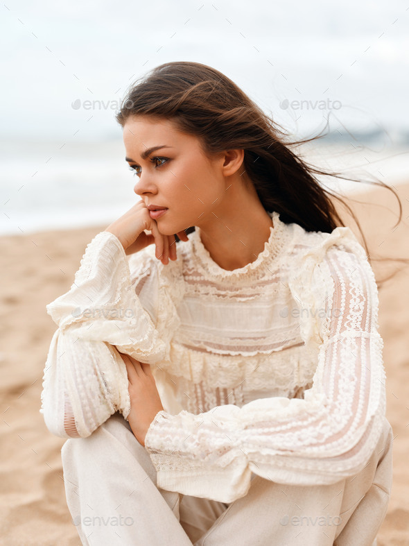 Beauty in Nature: Young Female Model Posing with a Pretty Smile, Enjoying  the Sunny Beach Lifestyle Stock Photo by shotprime