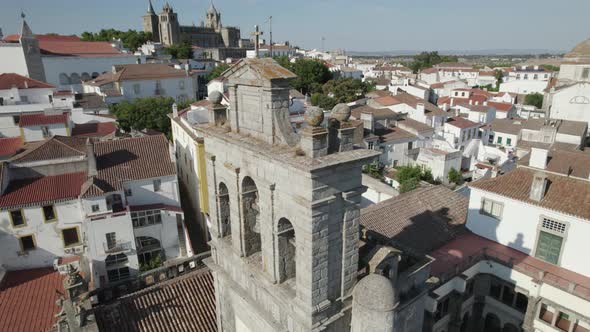 Aerial orbiting around Our Lady of Grace or Igreja da Graca church bell tower of Evora in Portugal