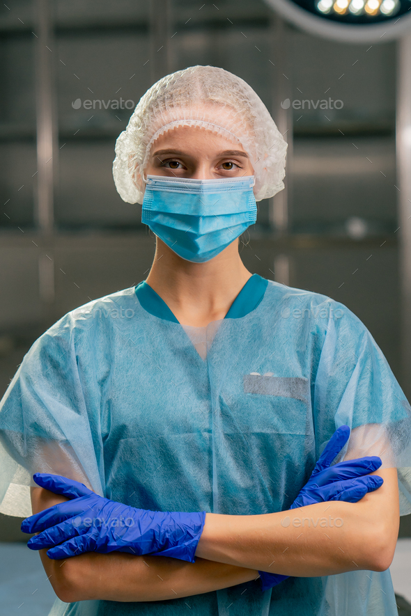 female anesthesiologist in uniform with her arms crossed in front of ...