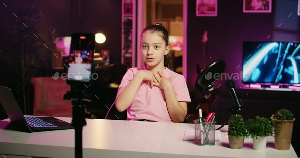 Gen Z child shooting video for social media platform, talking about her day