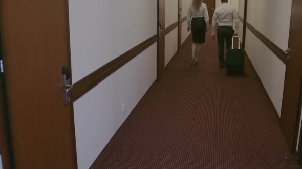 Business Partners Leaving Hotel alt