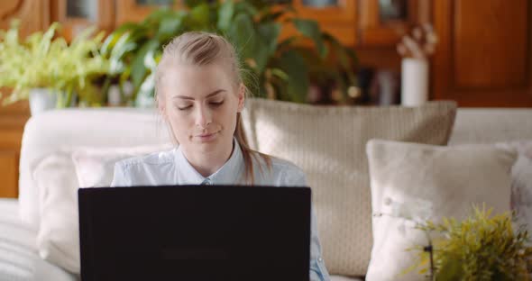 Beautiful Thoughtful Concerned Woman Working on Laptop alt