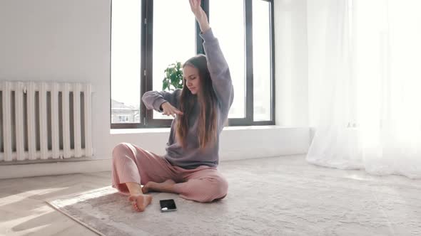 Young Inspired Woman with Long Hair Listening Music in Wireless Headphones alt