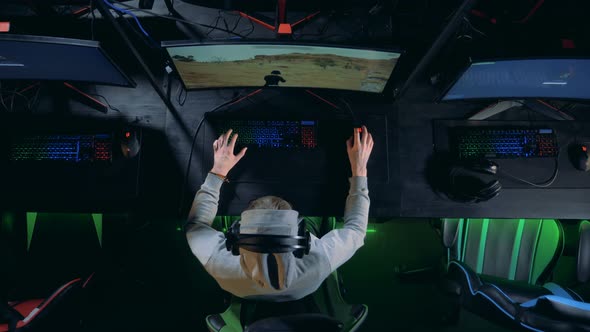 Young Gamer Playing on a Modern Pc. Cybersport Concept. alt